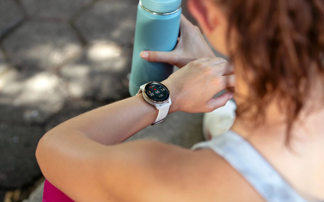 Women run with Garmin smartwatches