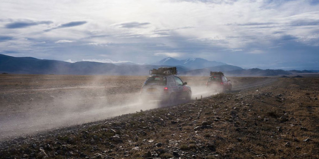 Cars driving in the Mongol Rally