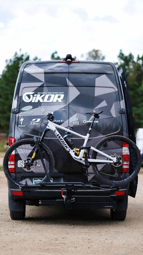 Exterior view of Garmin Ambassador Jimmy Smith's van with mountain bike on the back