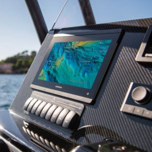 A Garmin chartplotter installed in a near-shore boating helm.