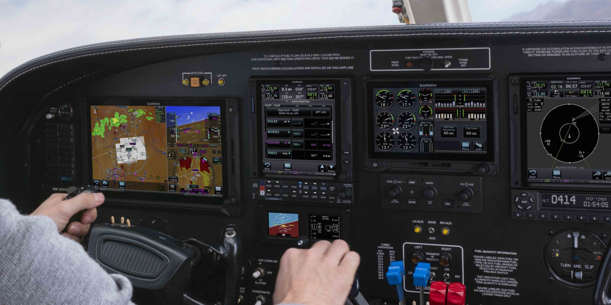 Aircraft cockpit with Garmin TXi displays, pilot in-flight