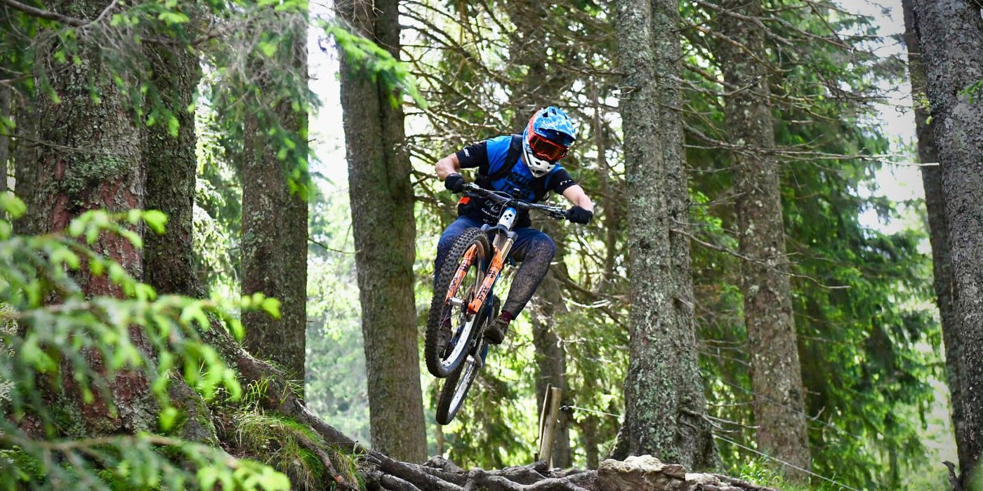 A CUBE Actionteam rider on an MTB trail