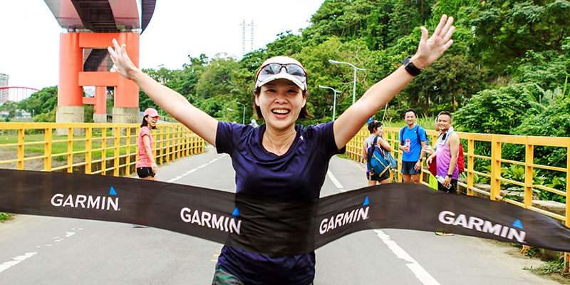 woman-happily-rushing-over-the-finish-line