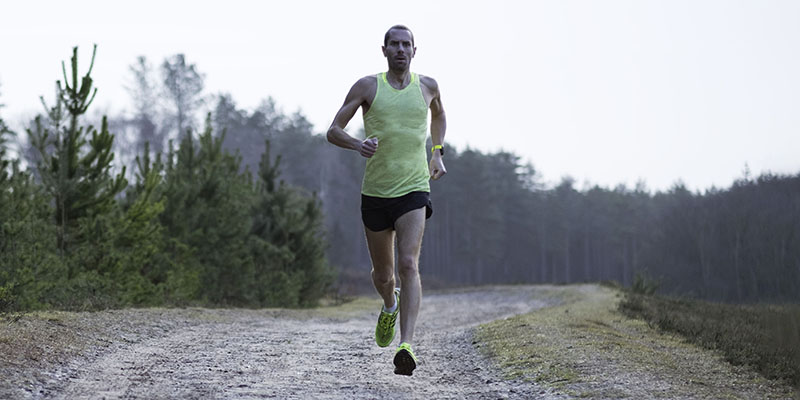 man-running-near-forest